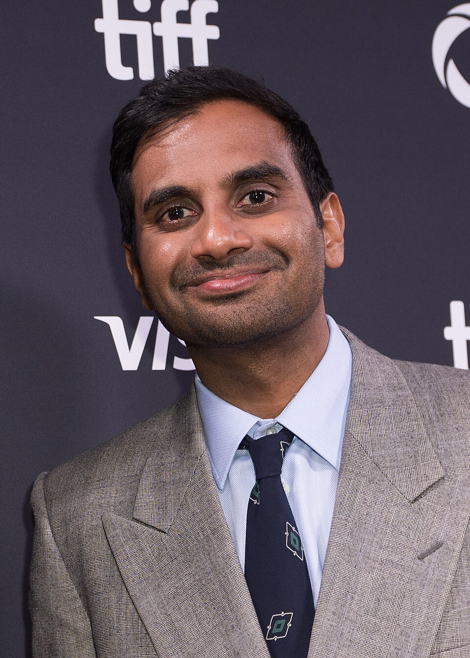 Tom Haverford in stylish business casual attire